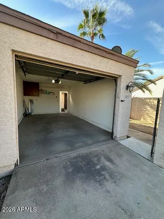 a view of a house with pool and chairs