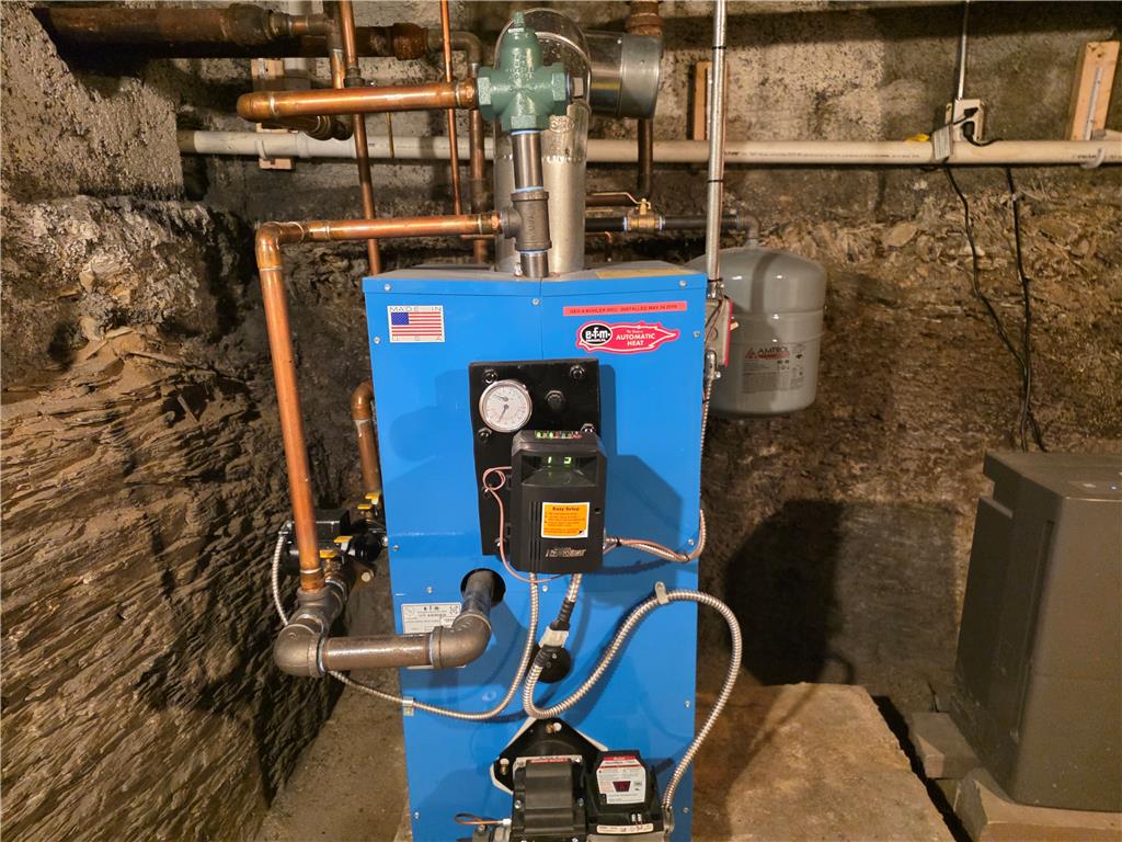 5166 Springmill Road Whitehall, PA 18052 - Photo 28 of 29 Essential mechanicals include a robust water heater and a comprehensive heating system.