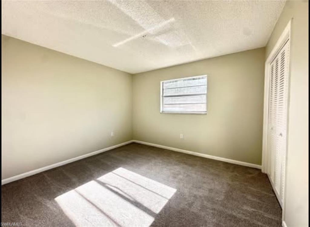 3325 Airport Road North, Unit D3 Naples, FL 34105 - Photo 2 of 3 an empty room with windows