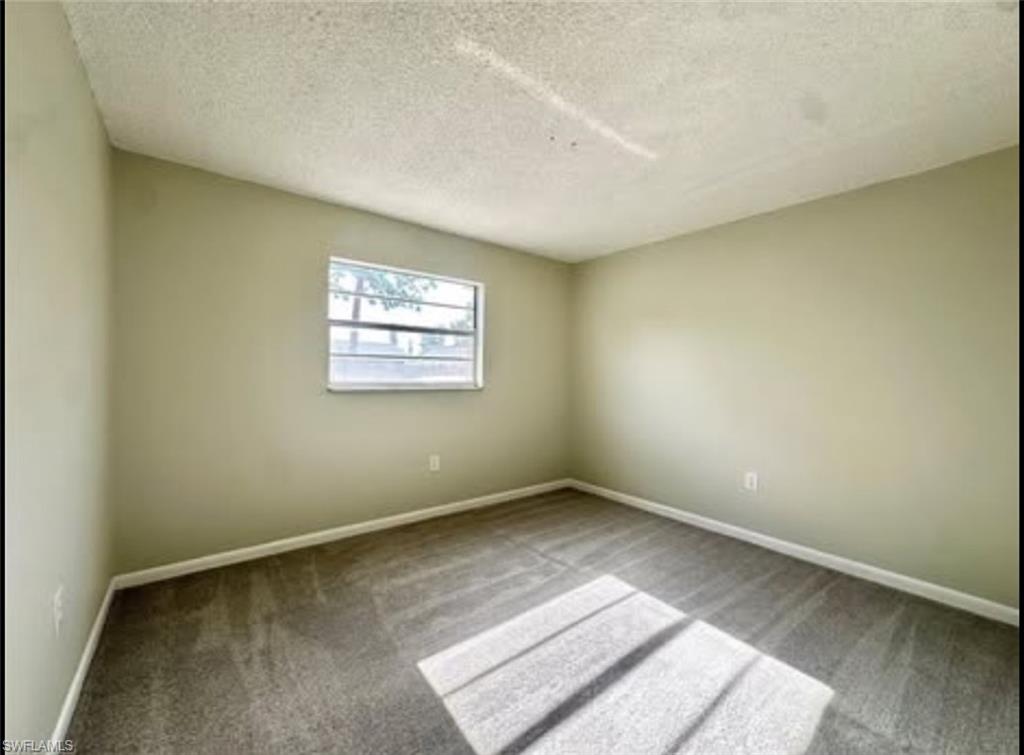 3325 Airport Road North, Unit D3 Naples, FL 34105 - Photo 3 of 3 an empty room with windows