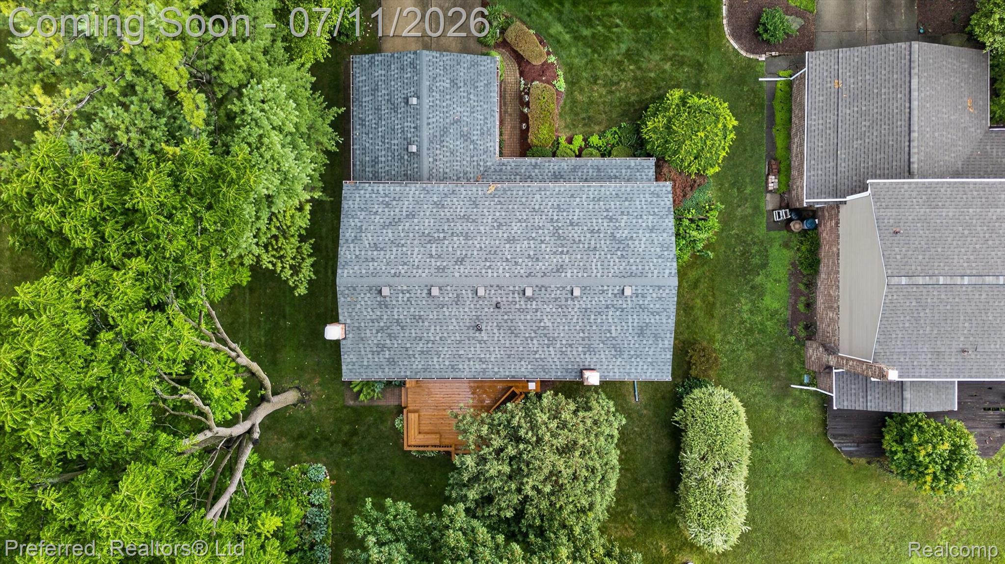 46596 Maidstone Road Canton, MI 48187 - Photo 56 of 61 Overhead view highlighting a shingled roof, a wooden deck, and mature surrounding trees