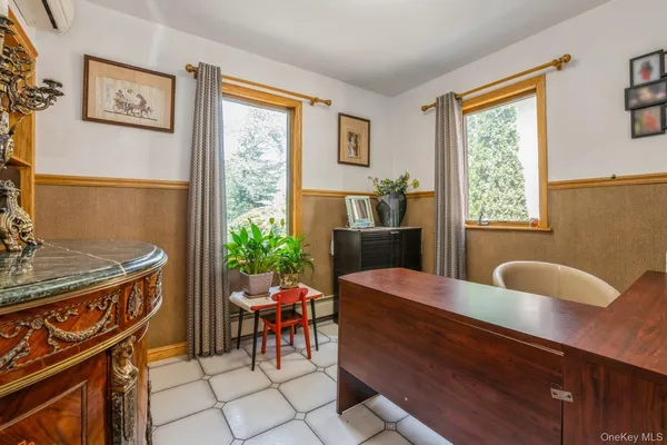 a view of a dining room with furniture window and outside view
