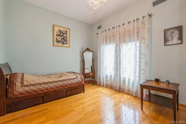 a bedroom with a bed and a furniture