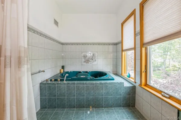 a bathroom with a sink a vanity and window
