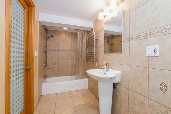 a bathroom with a sink a mirror and shower