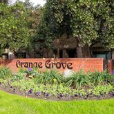 a view of sign board and green space