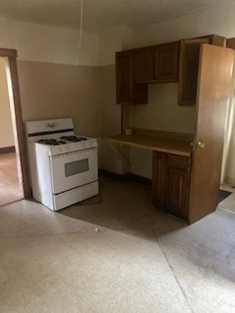 22-24 Cedar Street Springfield, MA 01151 - Photo 7 of 22 a kitchen with a stove and a refrigerator