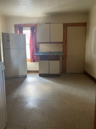 22-24 Cedar Street Springfield, MA 01151 - Photo 8 of 22 a view of kitchen with refrigerator and microwave