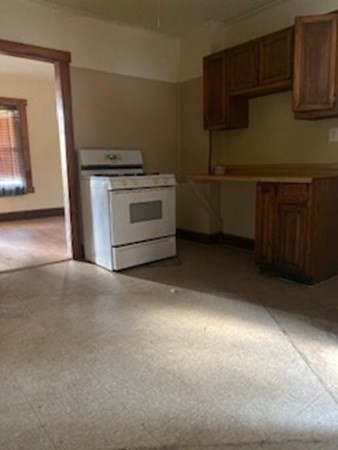 22-24 Cedar Street Springfield, MA 01151 - Photo 10 of 22 a kitchen with a stove and a microwave