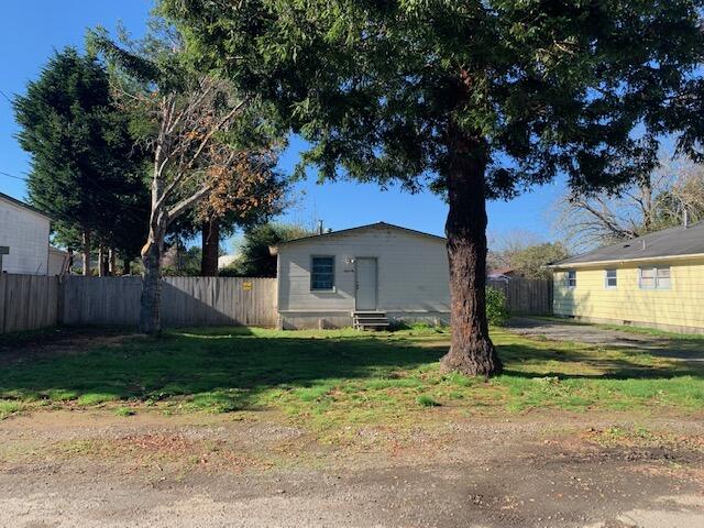 4040 Cedar Street Cutten, CA 95503 - Photo 1 of 21 a view of a backyard with large trees