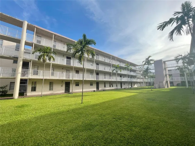 a view of building with yard