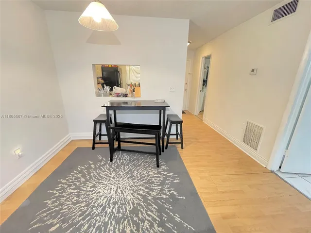 a view of a hallway with seating area