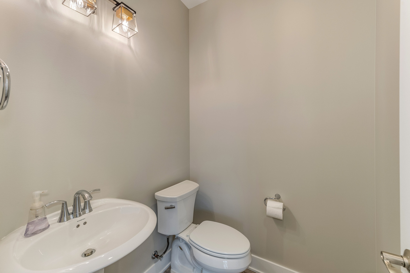 13101 Kettering Way Lemont, IL 60439 - Photo 19 of 36 a white toilet sitting next to a white sink