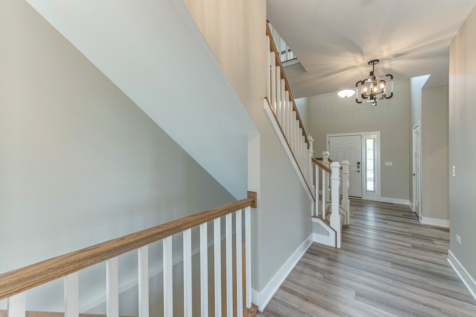 13101 Kettering Way Lemont, IL 60439 - Photo 3 of 36 a view of a hallway with wooden floor and staircase