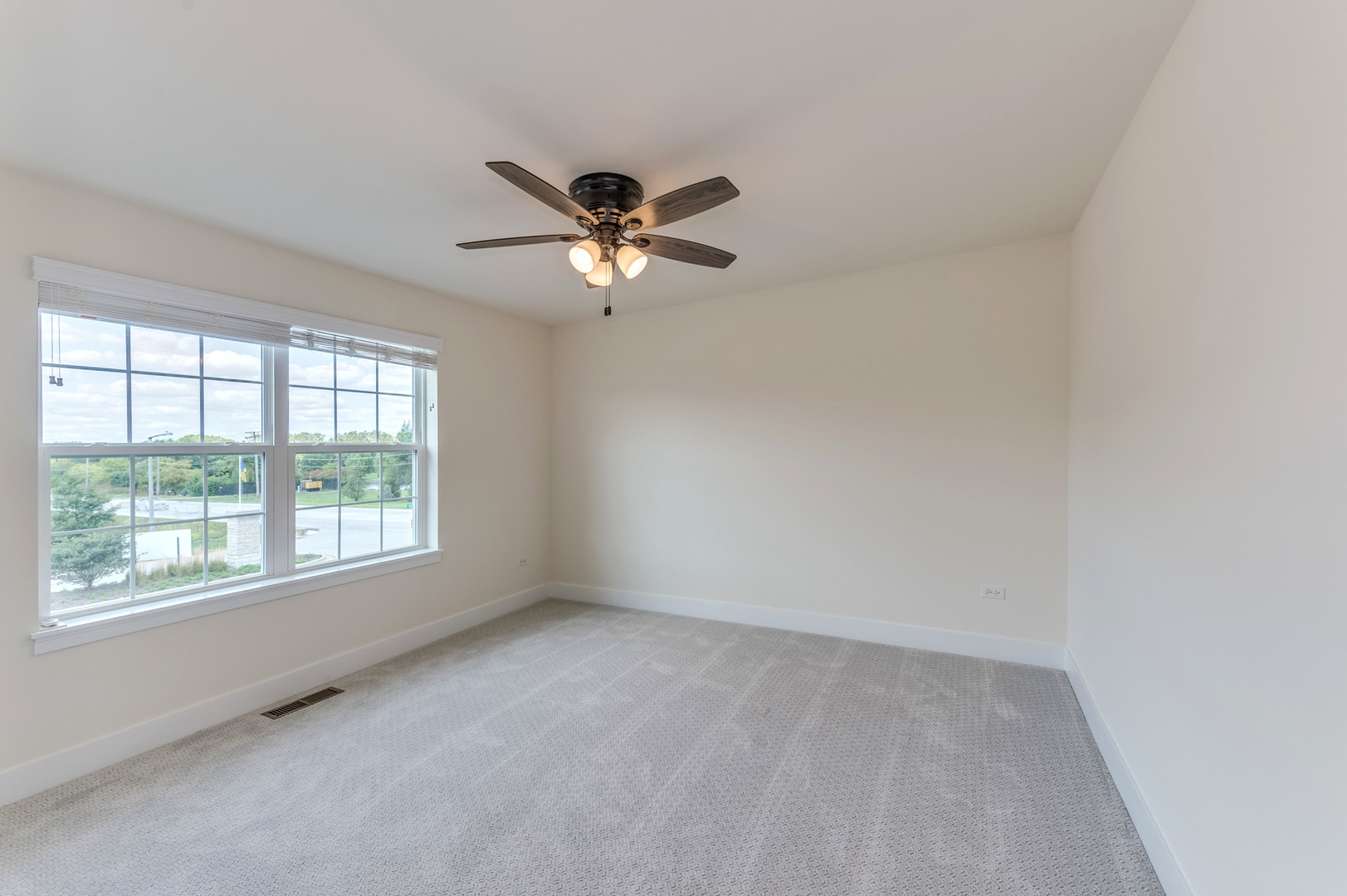 13101 Kettering Way Lemont, IL 60439 - Photo 29 of 36 an empty room with a window and a fan