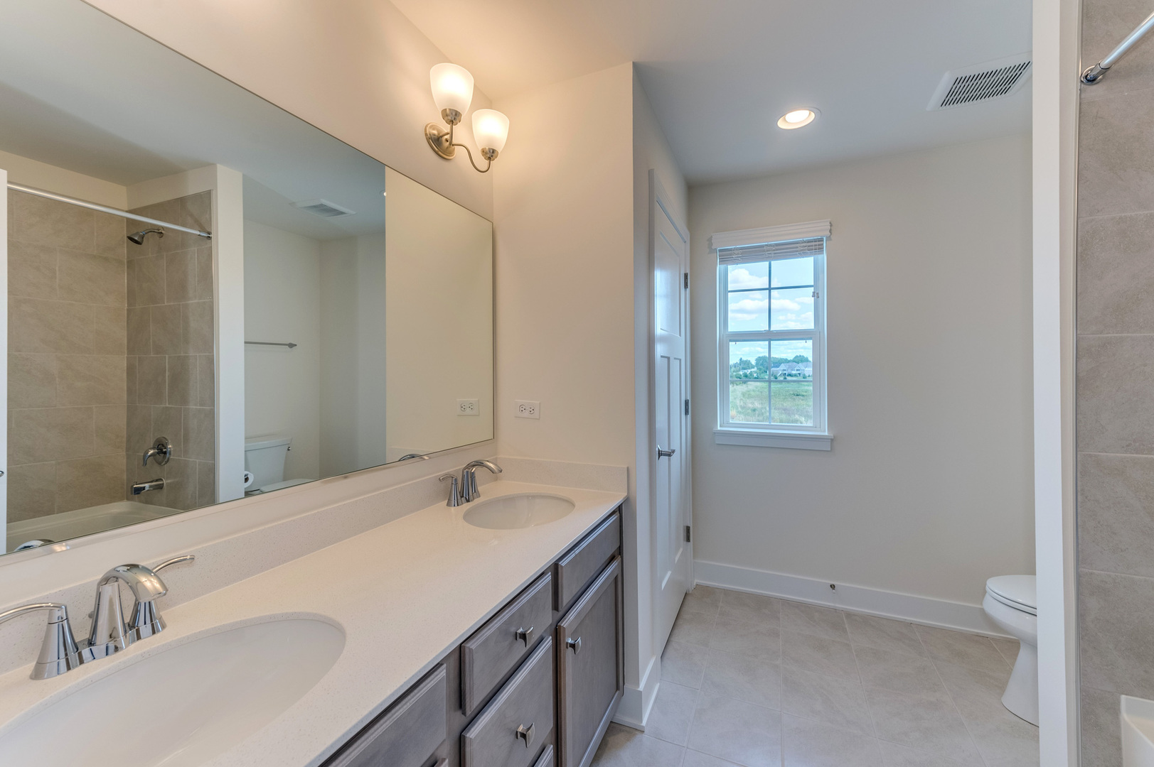 13101 Kettering Way Lemont, IL 60439 - Photo 30 of 36 a bathroom with a granite countertop sink and a mirror