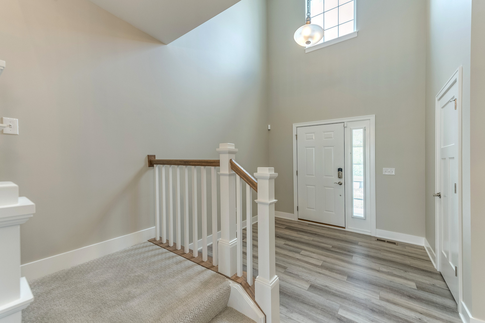 13101 Kettering Way Lemont, IL 60439 - Photo 4 of 36 a view of a hallway with wooden floor and staircase
