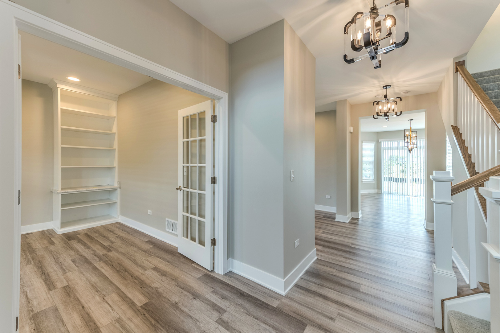 13101 Kettering Way Lemont, IL 60439 - Photo 6 of 36 a view of a hallway with wooden floor and staircase