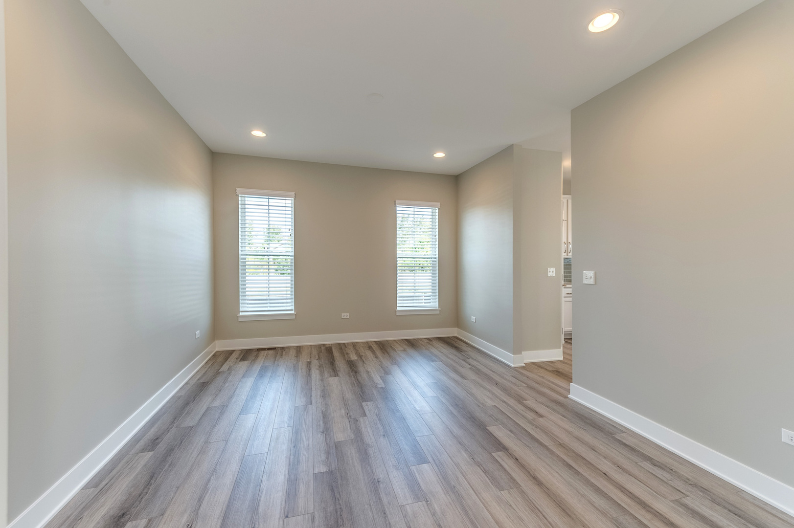 13101 Kettering Way Lemont, IL 60439 - Photo 8 of 36 wooden floor in an empty room with a window