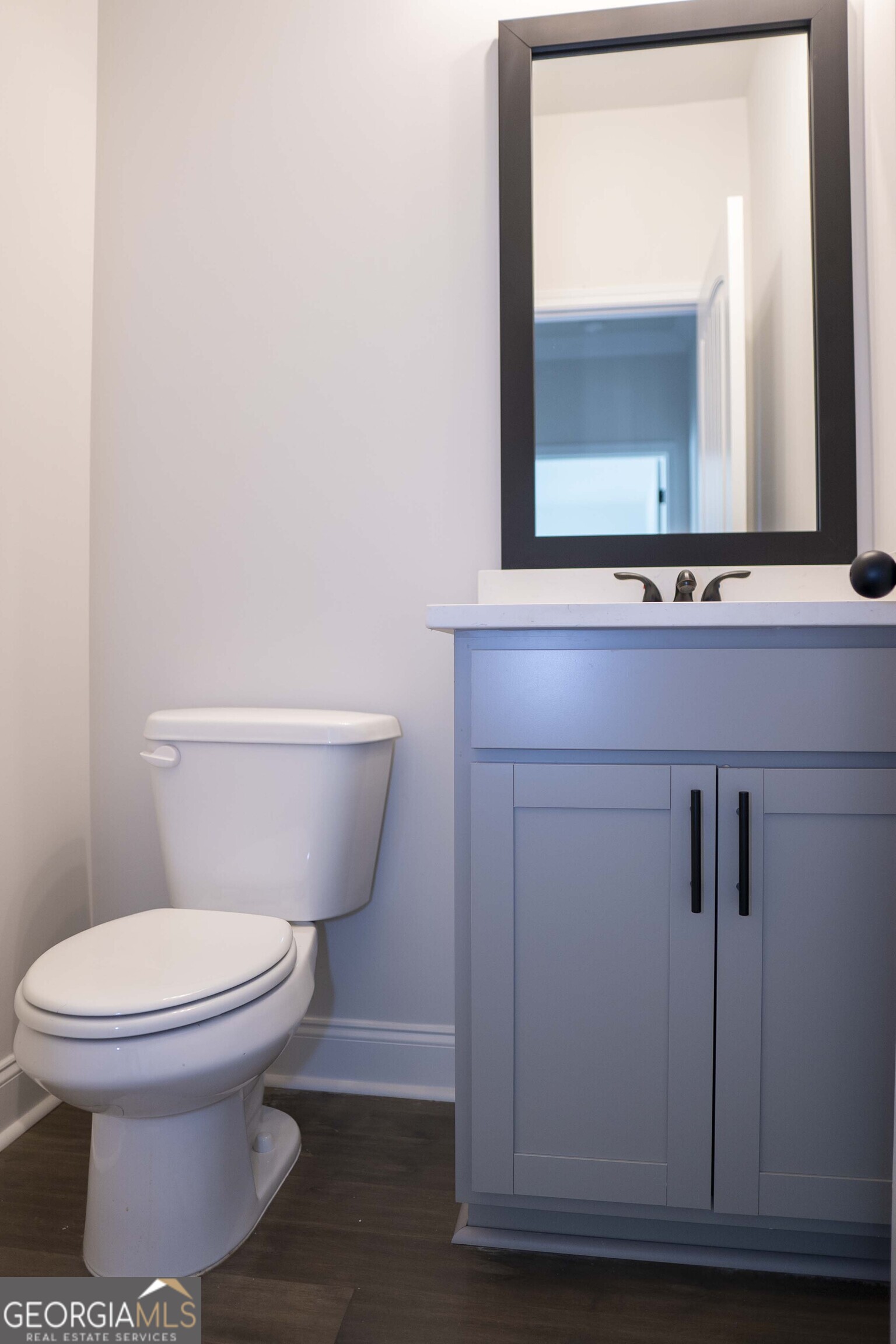 600 Beaver Court Perry, GA 31069 - Photo 25 of 48 a bathroom with a toilet sink and mirror