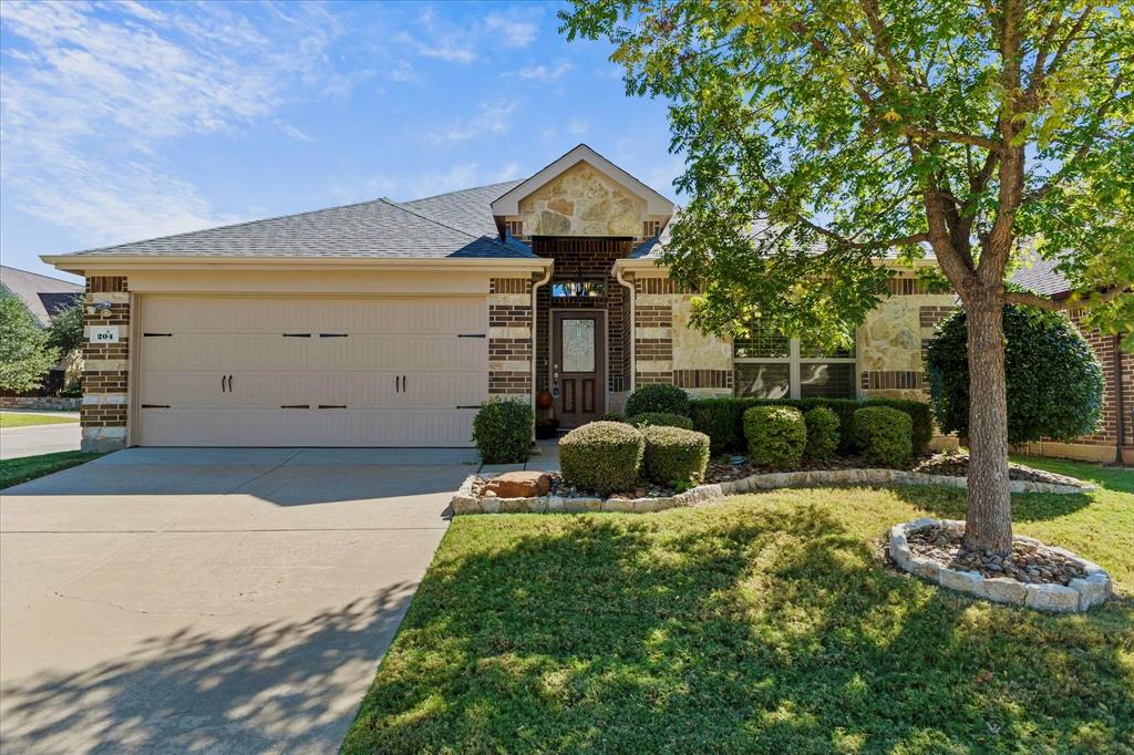 204 Tower Circle Terrell, TX 75160 - Photo 1 of 35 a front view of a house with garden