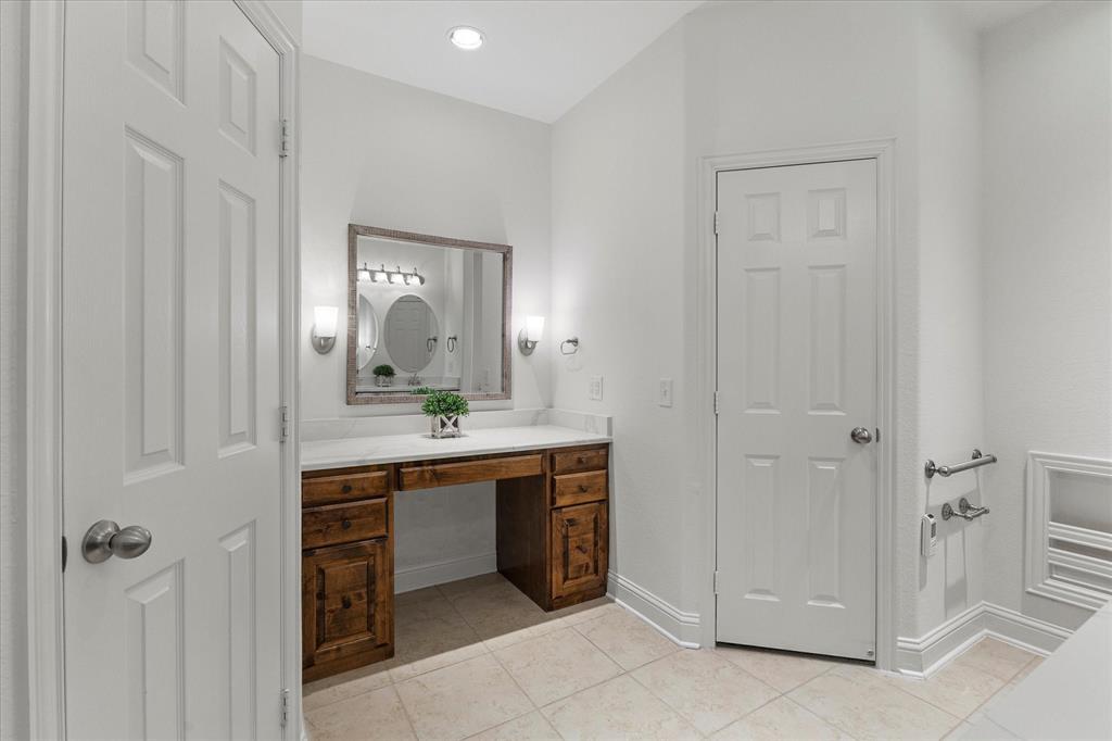 204 Tower Circle Terrell, TX 75160 - Photo 13 of 35 a bathroom with a granite countertop sink and a mirror