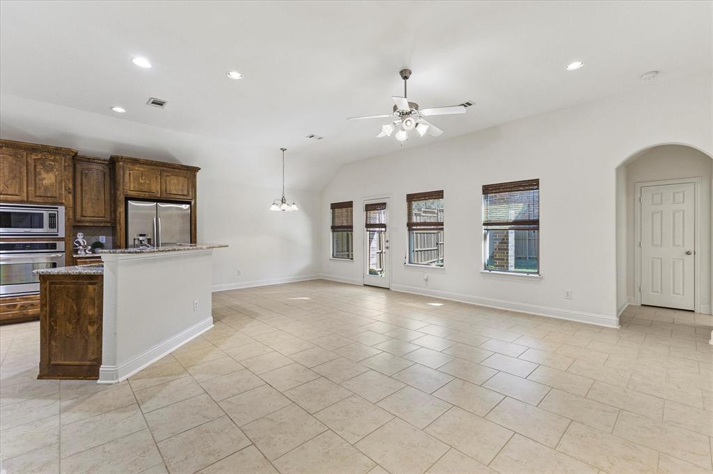 204 Tower Circle Terrell, TX 75160 - Photo 15 of 35 an empty room with kitchen view and a window