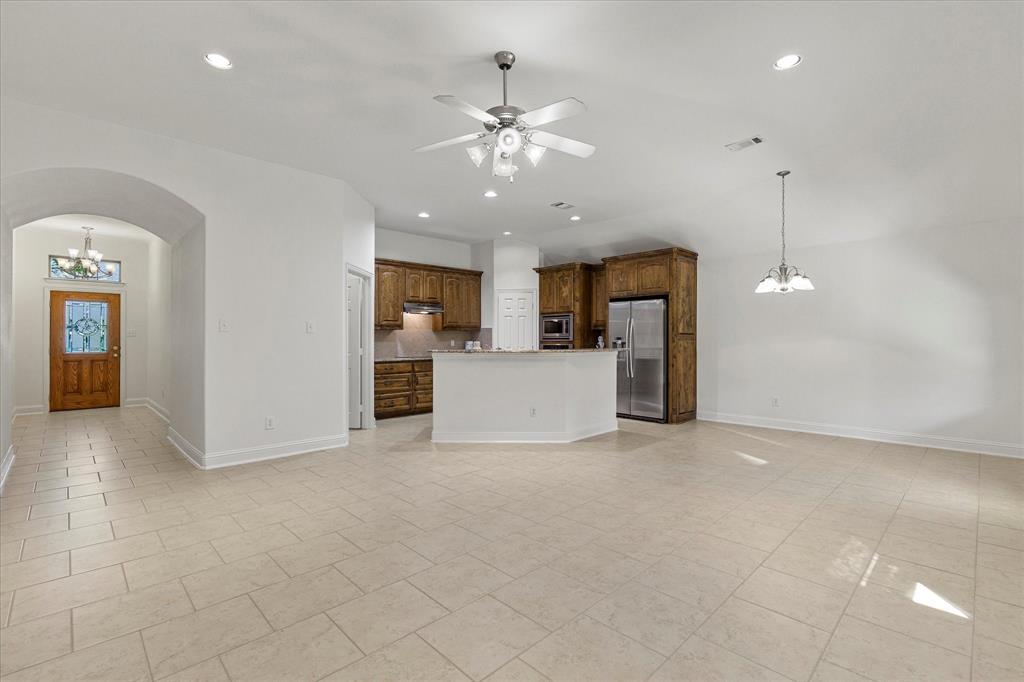 204 Tower Circle Terrell, TX 75160 - Photo 16 of 35 a view of a kitchen with a microwave and a refrigerator