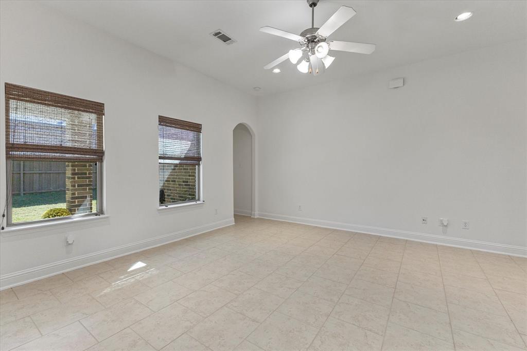 204 Tower Circle Terrell, TX 75160 - Photo 17 of 35 an empty room with windows and fan