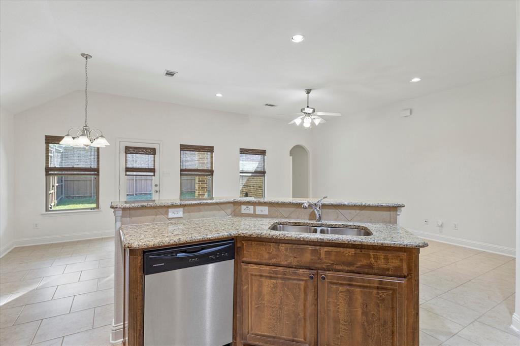 204 Tower Circle Terrell, TX 75160 - Photo 19 of 35 a view of a granite countertop cabinets a sink and dishwasher