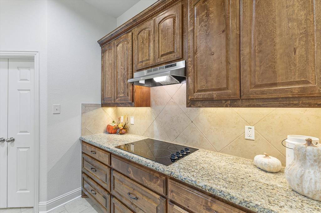 204 Tower Circle Terrell, TX 75160 - Photo 20 of 35 a bathroom with a granite countertop sink and a toilet