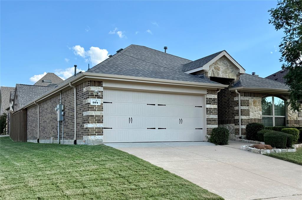 204 Tower Circle Terrell, TX 75160 - Photo 2 of 35 a house view with a garden space