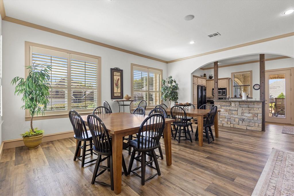 204 Tower Circle Terrell, TX 75160 - Photo 31 of 35 a view of a dining room with furniture and wooden floor