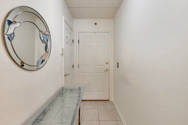 a bathroom with a granite countertop shower and a mirror