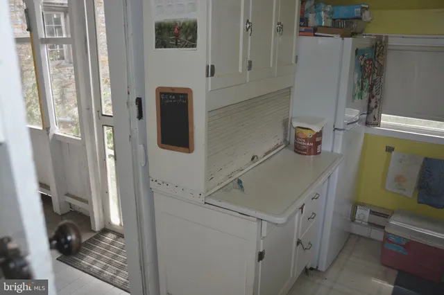 a view of a livingroom with furniture and a window