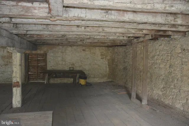 a view of a house with a yard and a street