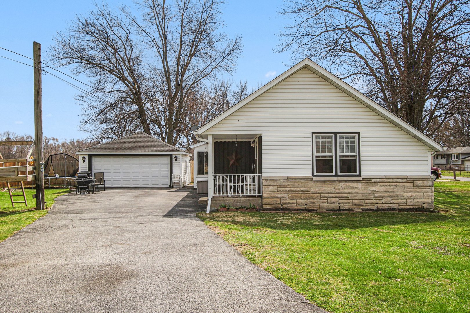 5335 Stone Avenue Portage, IN 46368 - Photo 15 of 17 a view of a house with a yard and large tree