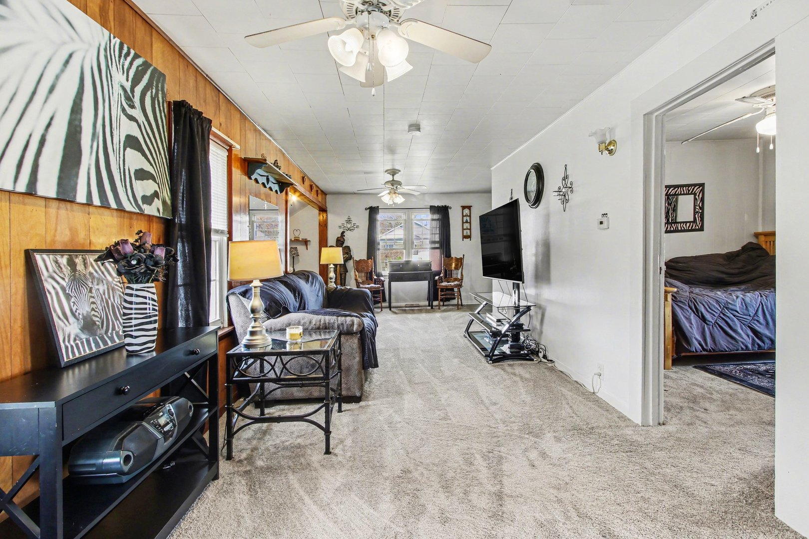 5335 Stone Avenue Portage, IN 46368 - Photo 5 of 17 a bedroom with furniture and a flat screen tv