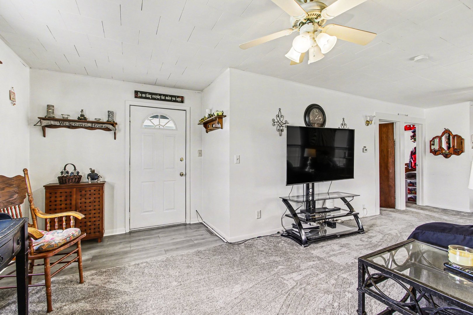 5335 Stone Avenue Portage, IN 46368 - Photo 6 of 17 a living room with furniture a flat screen tv and a window