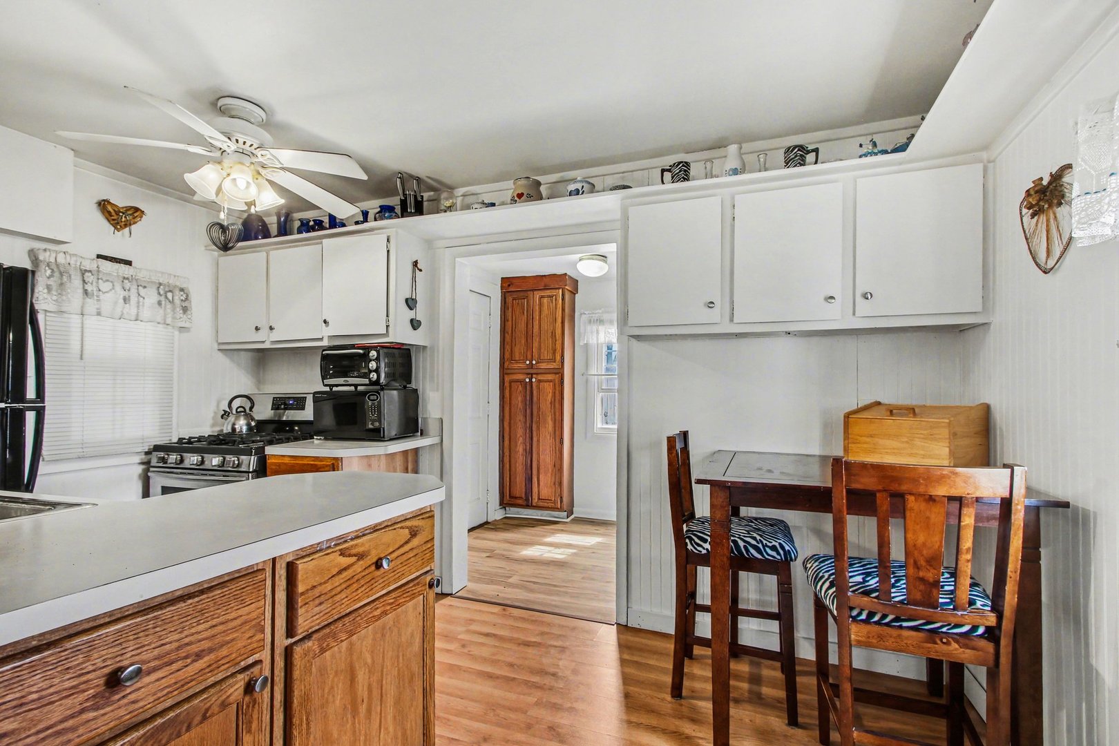 5335 Stone Avenue Portage, IN 46368 - Photo 7 of 17 a kitchen with stainless steel appliances granite countertop a refrigerator and microwave