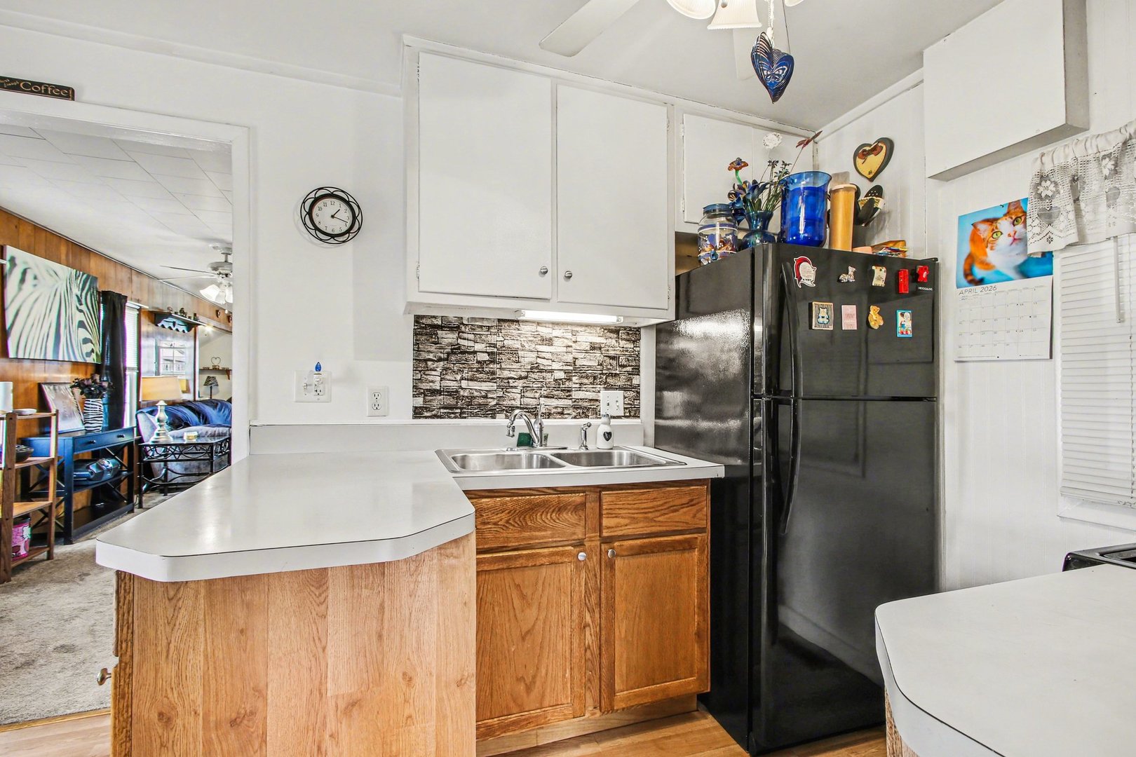5335 Stone Avenue Portage, IN 46368 - Photo 8 of 17 a kitchen with stainless steel appliances granite countertop a refrigerator and a sink