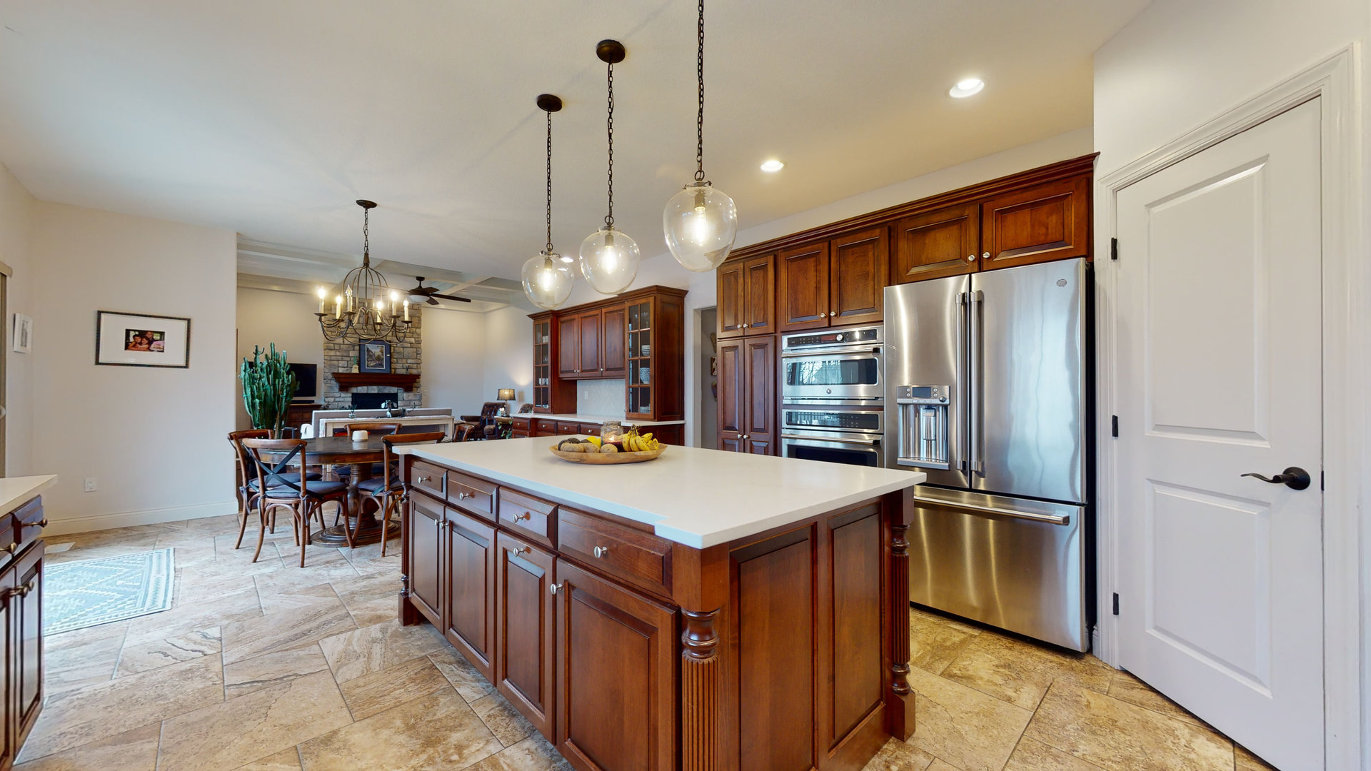 1303 East White Oak Road Mahomet, IL 61853 - Photo 11 of 64 a kitchen with stainless steel appliances granite countertop a refrigerator a sink dishwasher and a dining table with wooden floor
