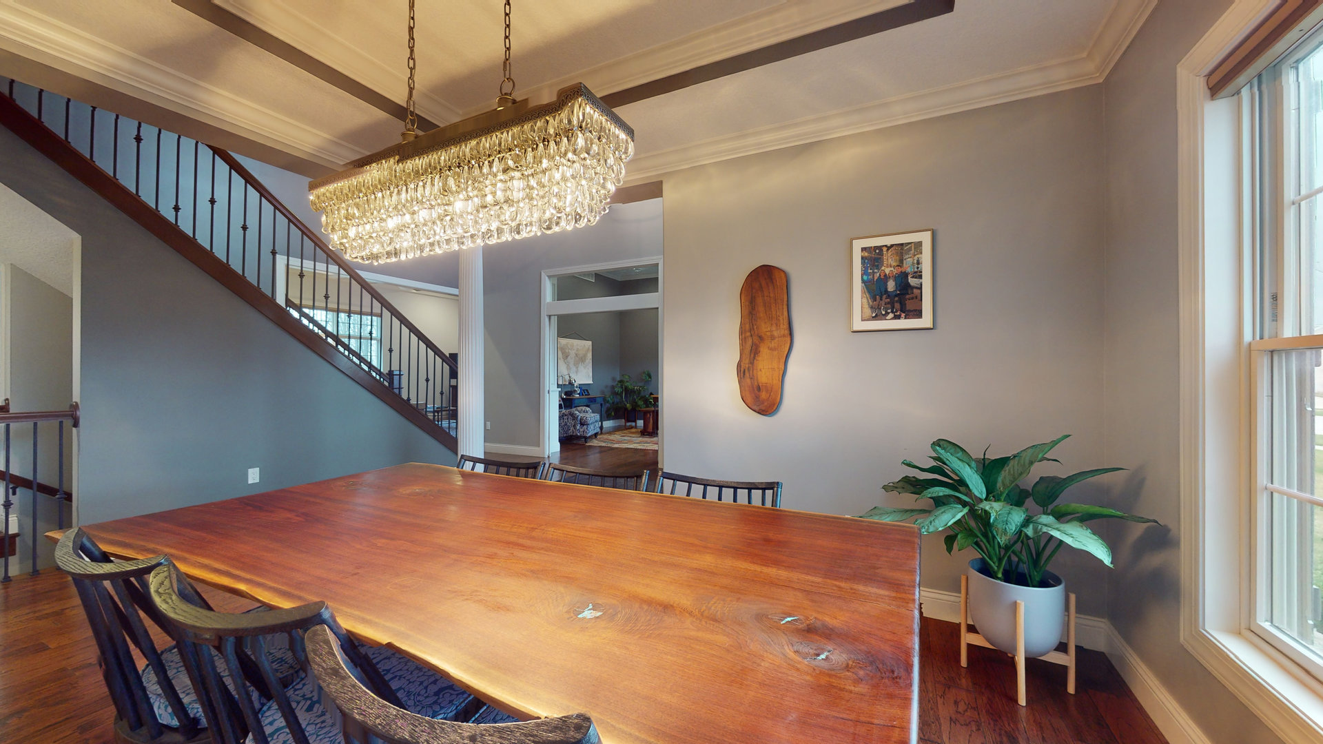 1303 East White Oak Road Mahomet, IL 61853 - Photo 13 of 64 a view of a dining room with furniture and a potted plant