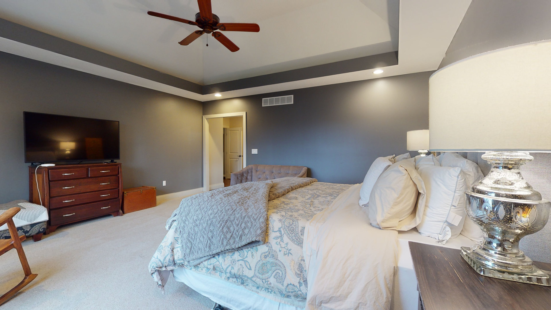 1303 East White Oak Road Mahomet, IL 61853 - Photo 18 of 64 a bedroom with a bed and flat screen tv