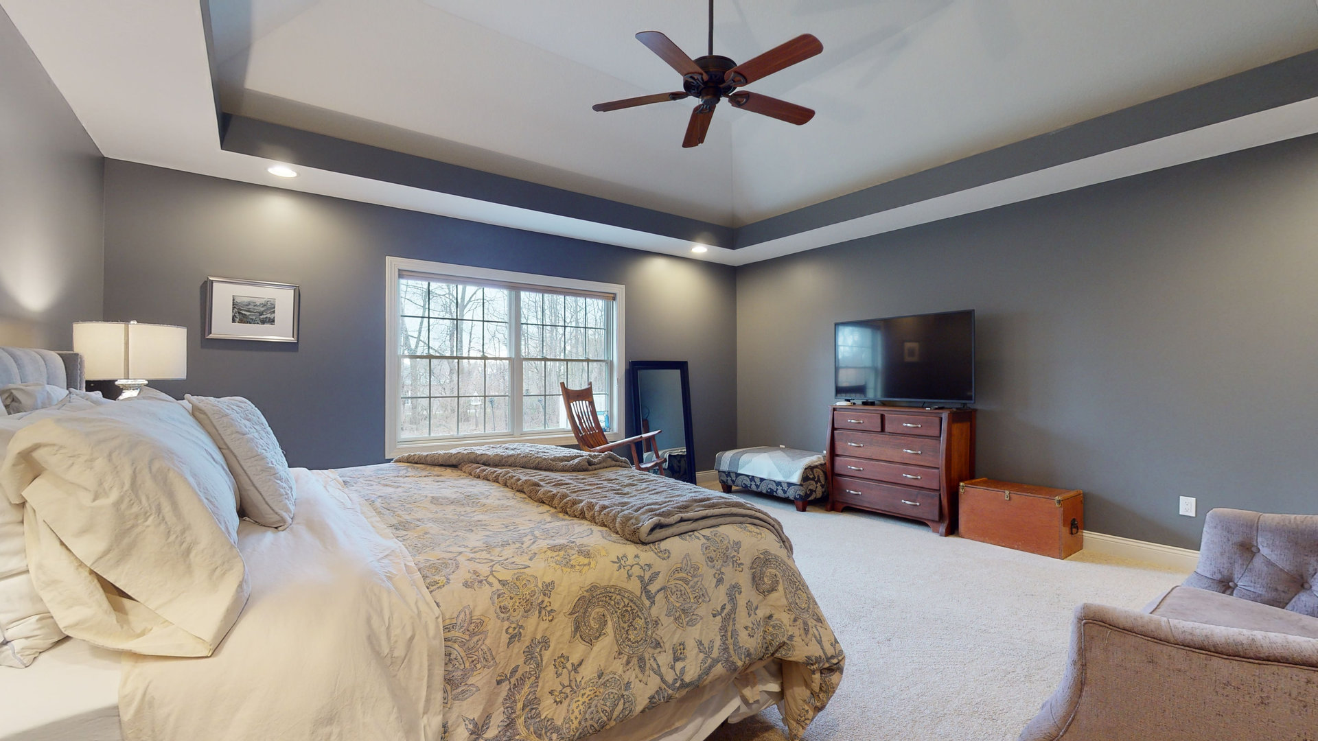1303 East White Oak Road Mahomet, IL 61853 - Photo 19 of 64 a bedroom with a bed and a flat screen tv