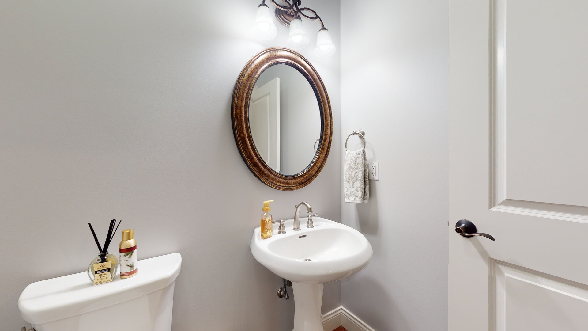 1303 East White Oak Road Mahomet, IL 61853 - Photo 22 of 64 a bathroom with a sink and a mirror