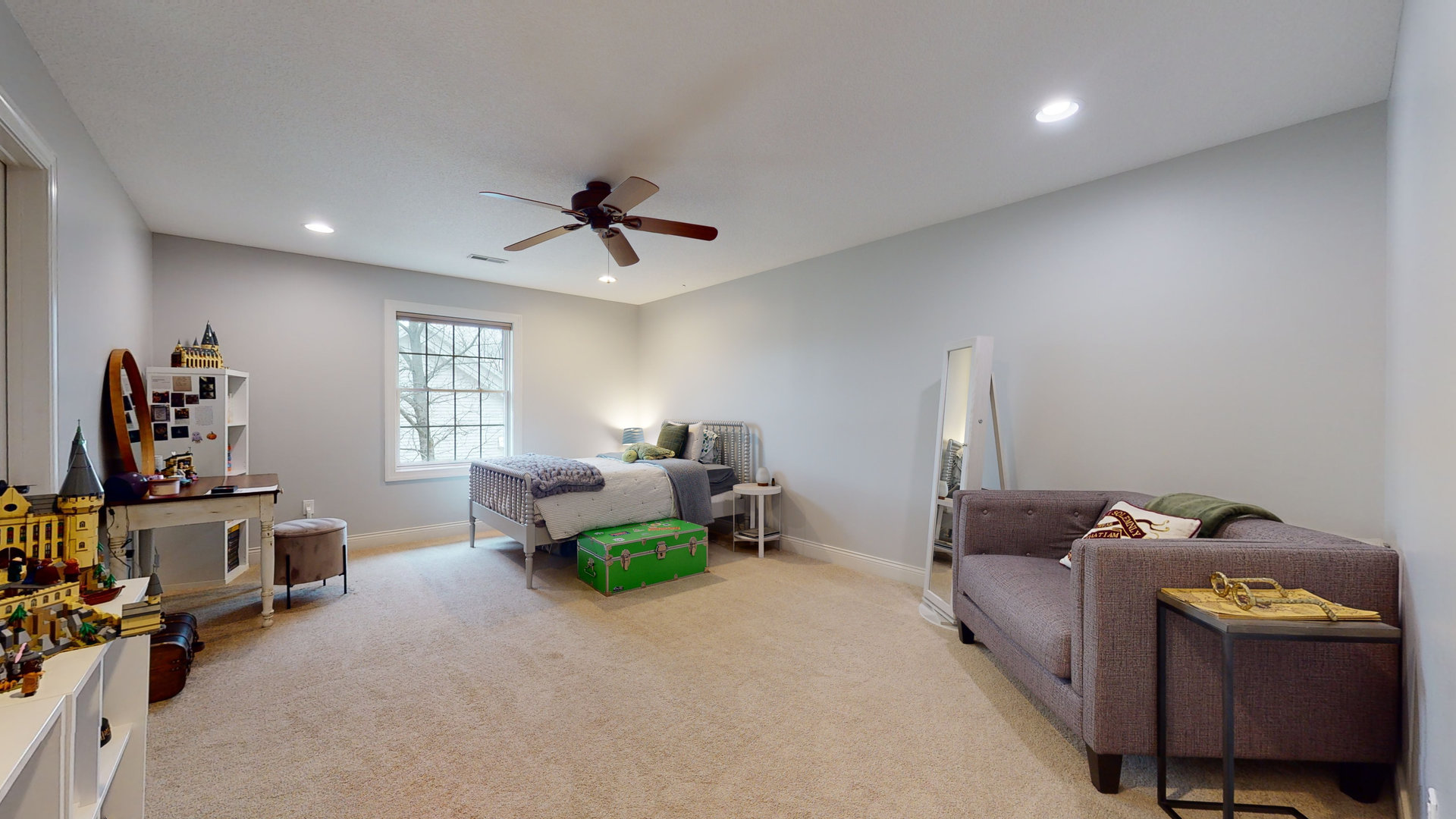 1303 East White Oak Road Mahomet, IL 61853 - Photo 28 of 64 a living room with furniture a window and gym equipment