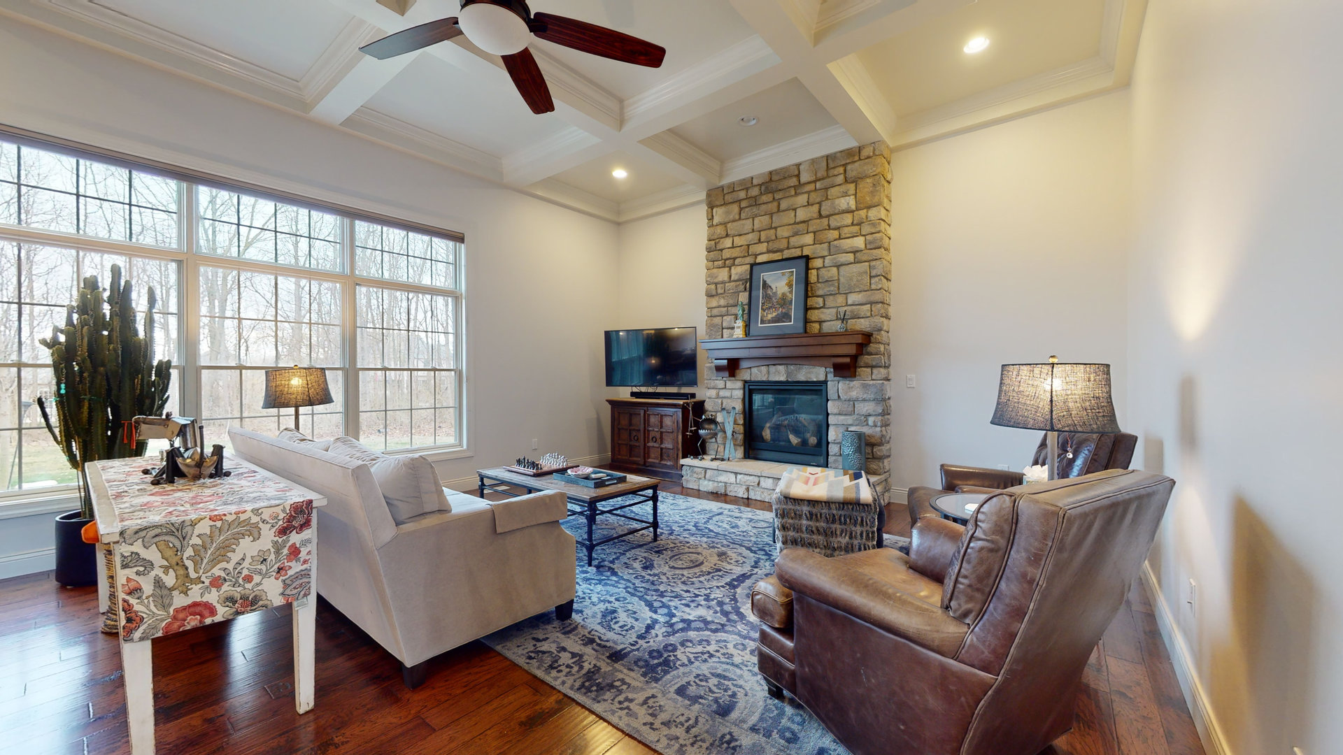 1303 East White Oak Road Mahomet, IL 61853 - Photo 3 of 64 a living room with fireplace furniture and a large window