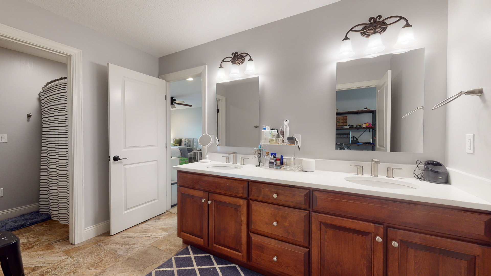 1303 East White Oak Road Mahomet, IL 61853 - Photo 31 of 64 a bathroom with a double vanity sink and a mirror