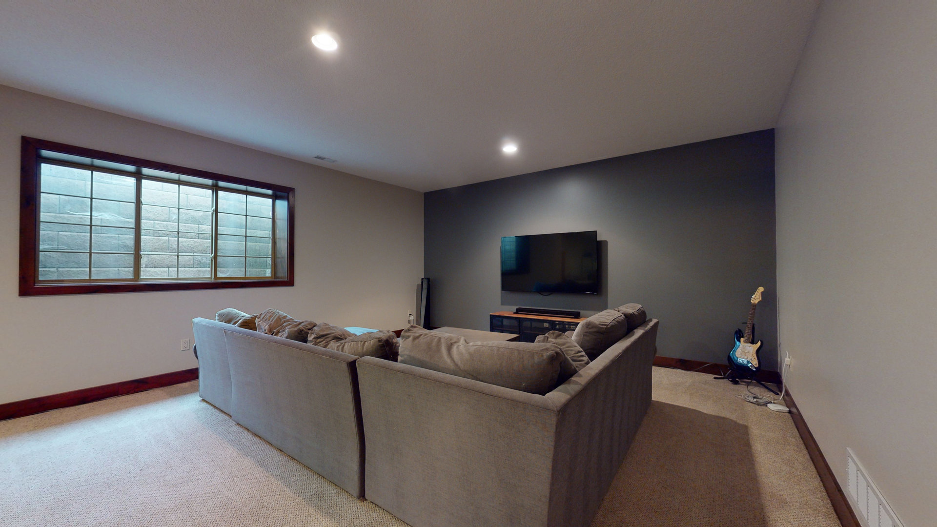 1303 East White Oak Road Mahomet, IL 61853 - Photo 32 of 64 a living room with furniture and a flat screen tv